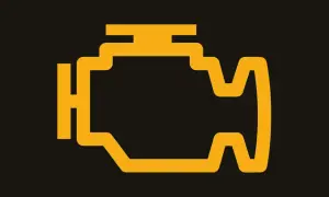 Gelbe Motorkontrollleuchte im Motorblock-Symbol. Ein Warnsignal, das bei einem BMW auf ein Problem hinweisen könnte.
