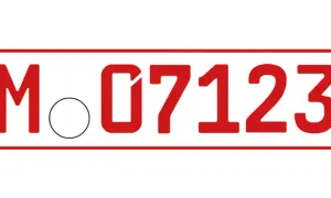 Rotes Kennzeichen "M 07123" mit Siegelkreis. Darf man mit roten Kennzeichen fahren? Ja, für Überführungs- oder Prüfungsfahrten.