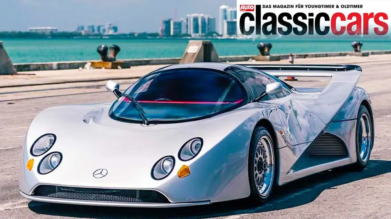 Silberner Lotec C1000 Supersportwagen mit markantem Heckspoiler und futuristischem Design, bereit für die Rennstrecke.